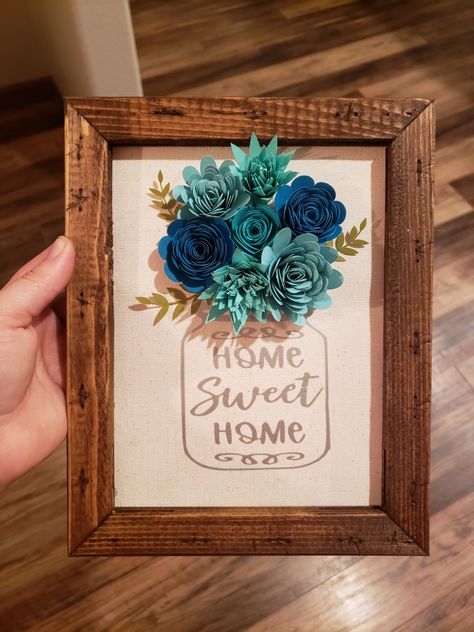 Cricut Reverse Canvas Ideas, Cricut Projects On Canvas, Vinyl On Canvas Ideas, Shadow Box Paper Flowers, Cricut Frame Ideas, Cricut Paper Flowers Shadow Boxes, Cricut Rolled Flower Projects, Cricut Flower Projects Gift Ideas, Cardstock Flowers Cricut