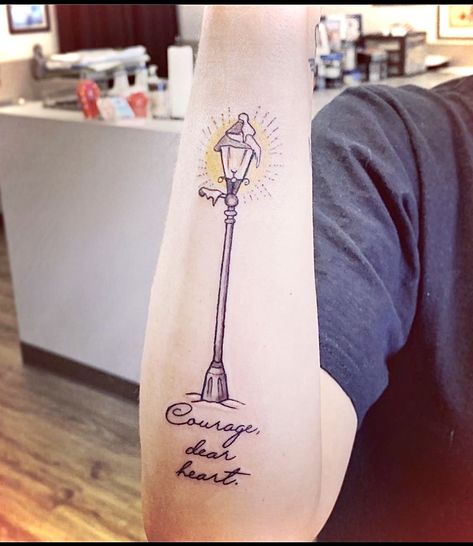 Lamppost from Narnia with my favorite quote, “Courage, dear heart.” Tattoo by Russ at Black Armor Tattoo in Plum, PA. He’s done all four of my tats so far! Narnia Lamppost Tattoo, Lamppost Tattoo, Narnia Tattoo Ideas, Courage Dear Heart Tattoo, Vermont Tattoo, Words Tattoo Ideas, Narnia Tattoo, Ash Tattoo, Drawing Words