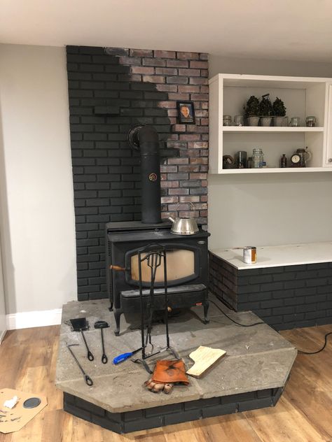 Painted Brick Behind Wood Burning Stove, Woodstove Makeover Before And After, Brick Fireplace With Wood Stove, Painted Brick Wood Stove Surround, Brick Wood Stove, Red Brick Living Room, Woodstove Ideas, Wood Stove Surround, Black Brick Fireplace