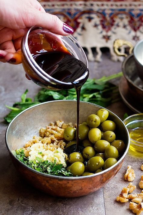 To make these marinated olives, mix all the ingredients, pour pomegranate molasses into the bowl and mix well. Iranian Cuisine, Marinated Olives, Olive Recipes, Persian Cuisine, Iranian Food, Pomegranate Molasses, Persian Food, Persian Style, Perfect Appetizers