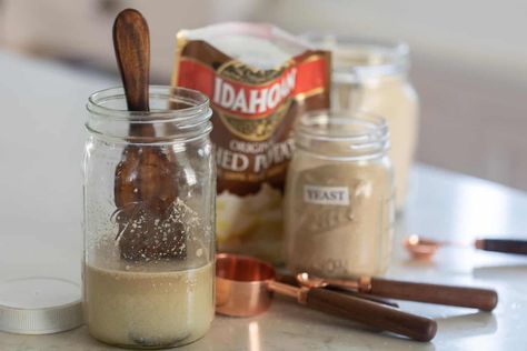 Learn how to make a potato flake sourdough starter. Made with sugar, dehydrated potatoes, and yeast, you can make delicious sandwich bread with a much sweeter taste than its typical sourdough counterpart. Plus, check out my sourdough sandwich bread recipe using potato flake starter! #farmhouseonboone #potatoflakesourdoughstarter #sourdoughbread #sourdoughsandwichbread #sandwichbread Sourdough Starter Recipe With Potato Flakes, Potato Flake Starter, Potato Flake Sourdough Starter, Dehydrated Potatoes, Bread Starters, Sourdough Sandwich Bread Recipe, Homemade Sourdough Bread Recipes, Starter Sourdough, Sourdough Starters