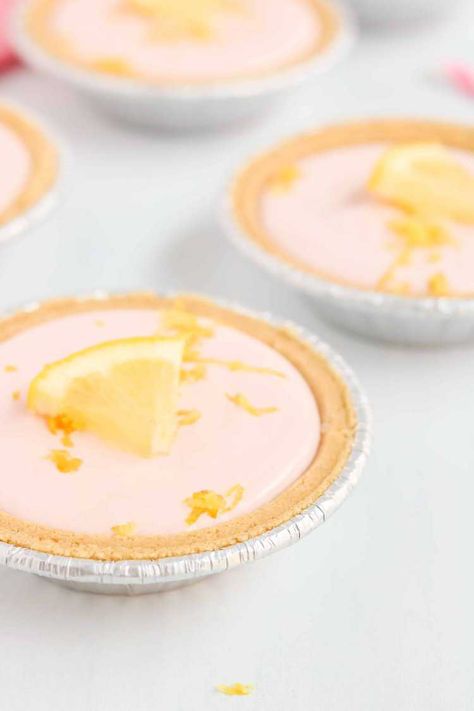 These Pink Lemonade Mini Pies are possibly the cutest things I have ever seen. Besides that, they are the easiest things I have ever made! Pink Lemonade Pie 3 Ingredients, Mini Pies Easy Graham Crackers, Orange Cream Mini Pies, Mini Graham Cracker Crust Pies, Mini Pies With Graham Cracker Crust, Easy Mini Pies, Muffin Tin Desserts, Pink Lemonade Pie, Small Pies