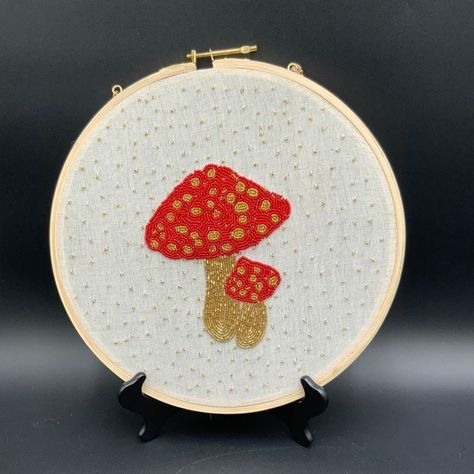 Ques Add Some Unique Charm To Your Home Dcor With These Beautifully Crafted Beaded Embroidery Mushrooms Handmade In India. The Intricate Detailing And Vibrant Colors Make Them A Perfect Accent For Any Room. The Embroidery Is Done With Utmost Skill And Precision, Showcasing The Impeccable Craftsmanship Of The Artisans. These Mushrooms Are Mounted On A 12 1/2" Hoop With Chain, Making It Easy To Hang Them On Your Walls. The Beaded Detailing Adds A Touch Of Elegance And Texture To The Piece. These H Embroidery Mushrooms, Handmade Mushrooms, Chain Making, Unique Charms, Red And Gold, Beaded Embroidery, Red Gold, Hand Crafted, Stuffed Mushrooms