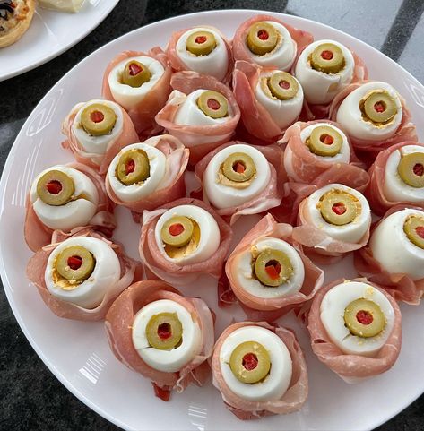 Monsters' eyes made with hard-boiled eggs, halved and topped with sliced olives Halloween Party Finger Foods, Spooky Snacks, Spooky Food, Party Finger Foods, Recipes To Make, Halloween 2024, Hard Boiled, Hard Boiled Eggs, Boiled Eggs