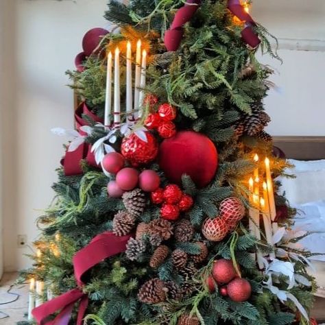 A tutorial on how I hang the candles on the tree. I tied a fishing line on the "flame" part of the candle, then hang it like an ornament… | Instagram Christmas Ball Clusters On Tree, Earthy Christmas, Decorating A Tree, Velvet Ornaments, Whimsical Christmas Tree, Nomad Hotel, Evening View, Whimsical Christmas Trees, Hanging Candles