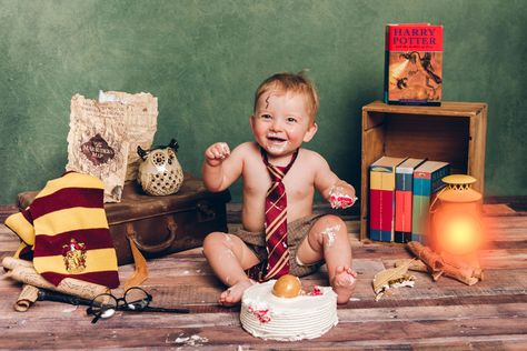 Harry Potter themed 1st birthday cake smash. Simple props used; Coles rainbow cake, our own HP books, snitch made from fondant and coated in gold cake paint (wings were BBQ skewers and paper) and a HP book-week dress up pack my eldest had. Plus one very creative photographer ;) Harry Potter Smash Cake Photos, Harry Potter Cake Smash First Birthdays, Harry Potter Cake Smash, Harry Potter Baby Birthday, Hp Cake, Harry Potter Theme Cake, Happy Birthday Harry Potter, Harry Potter Theme Birthday, Boys First Birthday Cake