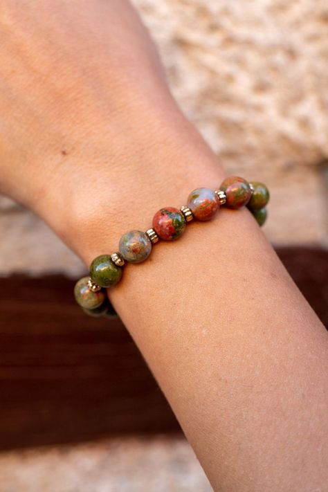 This bracelet contains 8mm Genuine Natural Unakite. Healing with Unakite ♥ Balances physical emotions ♥ Grounding All my bracelets are handmade with very high quality natural stones. The elastic wristband is comfortable and easy to use. I use 1mm high quality elastic cord. Nephew Gifts, Diy Bracelets Patterns, Natural Stone Bracelets, Couple Bracelets, Opal Stone, Etsy Jewelry, Stone Bracelet, Bracelet Patterns, Long Distance