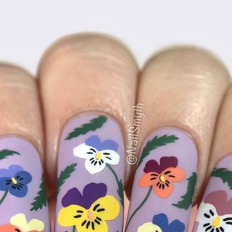 Marilynn on Instagram: "With less than a month of spring left, I’m trying to squeeze in as much floral stamping as possible! Today I was inspired by an adorable pansy design by @nbnailart . As soon as I saw Bianka’s mani I immediately bought the plate she used, Uber Chic’s “Floral Embrace”. Let me know what you think of this one! & be sure to check out Bianka’s super cute mani if you haven’t seen it. .💜Products used💜 Sally Hansen “Lacey Lilac” Uber Chic plate “Floral Embrace” What’s up Nails s Pansy Nails, Moyou Stamping, Hand Painted Nails, Up Nails, Lilac Nails, Spring Months, Floral Nail, Floral Nail Art, Floral Nails