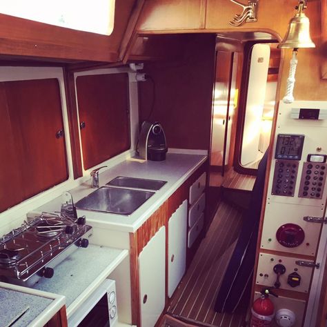 Updating your boat interior doesn't have to be expensive. 10 easy ways to update your sailboat interior including interior lights, boat interior upholstery ideas, and more. Boat Outfit, Boat Living, Boat Interior Design, Boat Galley, Interior Light Fixtures, Sailboat Interior, Nautical Interior, Boat Restoration, Upholstery Ideas