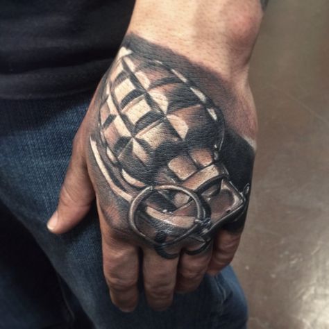 Grenade hand tattoo done by Chris Burnett evangel ink tattoo hesperia ca Hand Armor Tattoo, Spartan Hand Tattoo, Americana Hand Tattoo, Tank Tattoo Design, Gas Mask Hand Tattoo, Dead Man’s Hand Tattoo, Brass Knuckle Tattoo, Tank Tattoo, Knuckle Tattoos