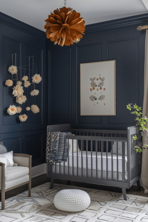 Set up a chic nursery with a nautical navy blue boho interior. Deep blue tones soothe the senses, while boho chic accents stimulate youthful curiosity. The room features comfortable furnishings and adaptable decor that grows with your child. Navy offers a timeless, versatile backdrop for a gender-neutral nursery. Tap here for more navy chic nursery designs. Midnight Blue Nursery, Navy Blue Nursery Gender Neutral, Dark Blue Nursery Boy, Dark Blue Baby Room, Baby Boy Nursery Navy Blue, Moody Blue Nursery, Dark Blue Kids Room, Dark Blue Nursery Ideas, Navy Blue Nursery Ideas