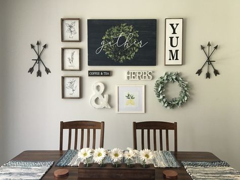 2 Arrow Sconces, 3 Herb Signs, Black Coffee & Tea Sign, Whitewashed Ampersand, Whitewashed Herbs Cutout, Framed Lemons Watercolor, Dark Blue Gather Sign (wall centerpiece), Yum Sign, Lamb’s Ear Wreath. All items purchased from Hobby Lobby🙌🏻 Used craft paper and painters tape to set layout and then hang. Super easy! Kitchen Dinning Room Wall Decor, Ampersand Decor Ideas, Dining Room Decor For Walls, Small Dining Room Wall Art, Kitchen Wall Decor Ideas Above Table, Black Kitchen Wall Decor, Hobby Lobby Farmhouse Wall Decor, Kitchen Dining Wall Decor, How To Decorate A Large Dining Room Wall