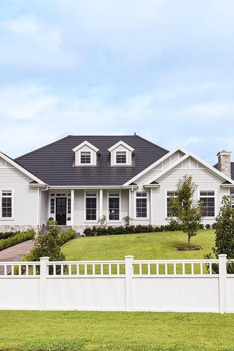 Brilliant kerb appeal with grand proportions and architectural embellishments of Hamptons style with pitched roofs, barn-style double garage, coastal-style cladding painted in Dulux Dieskau, and the infinite panelled windows and fencing painted in Dulux Vivid White. Front Fence Ideas, Dulux Dieskau, Hampton Exterior, Hamptons Exterior, Country Hamptons Style, Hamptons House Exterior, East Coast Style, Provincial Home, Fence Designs