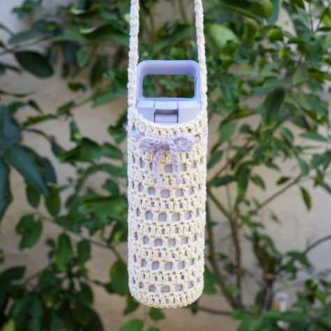 Crochet a bag for your water bottle to stay hydrated while out and about! This crochet water bottle holder pattern can fit any size bottle and be worn on the shoulder or as a crossbody Crochet Water Bottle Holder Pattern, Water Bottle Holder Pattern, Crochet A Bag, Crochet Water Bottle, Crochet Water Bottle Holder, Small Water Bottle, Water Bottle Carrier, Crochet Mushroom, Medium Weight Yarn