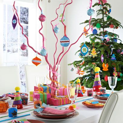 'Children's party' table... lines of thick ribbons laid along the table as an alternative runner.... ribbon-wrapped vase displaying a centrepiece of bendy bamboo twigs which have been spray-painted & decorated with felt baubles... Colourful Christmas Table Setting, Colourful Christmas Table, Xmas Tables, Table Christmas Decorations, Felt Baubles, Insights Discovery, Colorful Christmas Decorations, Christmas Palette, Xmas Table Decorations