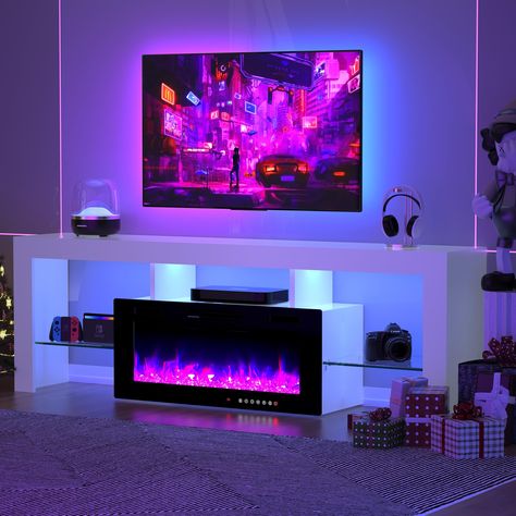 PRICES MAY VARY. Fits TVs 80"+: This modern 70 inch tv stand accommodates up to 80-inch TVs within its broad 70-inch design, complemented by an integrated 36-inch electric fireplace for a cozy atmosphere. Maximum weight capacity: 250 lbs. 144 Multiple Color Combinations: Elevate your ambiance with our lifelike 36-inch fireplace adorned with realistic crystal stones. Explore 12 vibrant flame colors with a fire gradient effect, and tailor brightness across 5 levels for the ideal setting. The LED l Tv Fireplace Stand, Tv Camino, Fireplace Stand, 70 Inch Tv Stand, Tv Fireplace, Floating Fireplace, White Entertainment Center, Floating Entertainment Center, Fireplace Entertainment Center