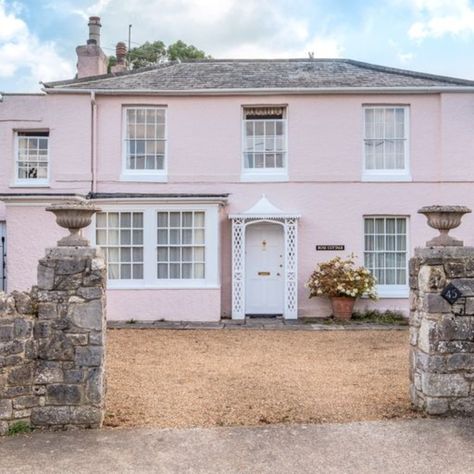 Rose Cottage is the childhood home of The Pink Panther actor David Niven in the village of Bembridge on the Isle of Wight. Boasting a pastel pink exterior and overlooking the church and the village green, the Grade II-listed Regency property was a seaside haven for the famous actor and novelist when he was growing up. (Photos: Hose Rhodes Dickson via OnTheMarket). House Exterior Ireland, Pink House Exterior, David Niven, The Pink Panther, Village Green, Ireland Homes, Childhood Home, Mansions For Sale, Georgian Homes