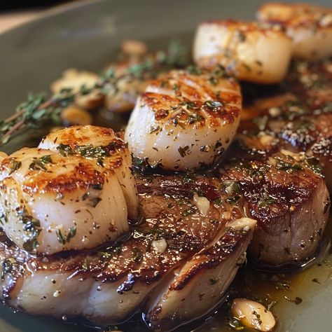 🥩🍽️ Luxurious Seared Steak and Scallops for a special dinner night! #GourmetAtHome 🍽️ Seared Steak and Scallops 🛒 Ingredients: Steak: 2 (ribeye or sirloin) Scallops: 12, large Garlic butter: 2 tbsp Fresh thyme: 1 tbsp 👩‍🍳 Instructions: Sear steak: 4 min each side, rest. Cook scallops: In garlic butter, 2 min each side. Garnish: With thyme. 🍴 Indulge in this restaurant-quality meal at home. A luxurious feast! #DateNightDishes Steak And Scallops Recipes, Steak And Scallops, Scallops Recipes, Cook Scallops, Sear Steak, Hibachi Steak, Instagram Recipes, Seared Steak, Rib Eye