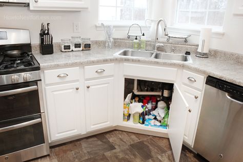 How to Organize Under Your Kitchen Sink Corner Sink Kitchen Organization, Corner Sink Under Cabinet Storage, Under Sink Corner Cabinet, Corner Under Sink Cabinet, Corner Sink Storage Ideas, Corner Sink Cabinet Organization, Under Corner Kitchen Sink Organization, Corner Kitchen Sink Organization, Corner Under Sink Organization