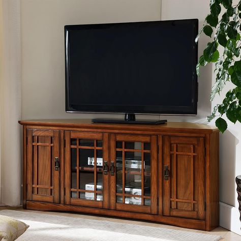 Color: Mission Oak Brand: Leick Home Size: 60-inch This console holds TVs up to 60" with a 260 lb. weight bearing capacity. It includes hardwood solids and veneers in a hand applied Mission Oak finish. The adjustable component shelves sit behind beveled and tempered glass door with blackened mission pull hardware. Each end comes with adjustable shelves! Oak Corner Tv Stand, Corner Tv Console, 60 Tv Stand, Oak Tv Stand, Living Room Entertainment Center, Tv Console Table, Corner Tv Stand, Mission Oak, Corner Tv