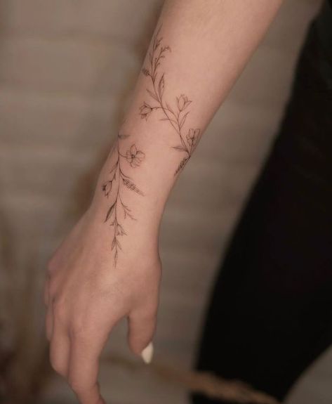 Vine Flower Arm Tattoo, Dainty Arm Wrap Tattoos For Women, Small Wrist Wrap Tattoos, Flower Cuff Tattoo Forearm, Wrapped Tattoo Arm, Arm Rap Tattoo, Botanical Wrist Wrap Tattoo, Flower Tattoo Around Wrist, Flower Arm Cuff Tattoo