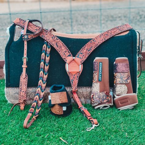 Keep it simple but interesting with this gorgeous tooled tack collection by Rafter T. The lovely floral detailing is set off by the black background lending a subtle but stunning look.  Note - The boots and reins are shown for demonstration only and are not included in a tack set purchase. They may be purchased separat Orange Horse Tack Western, Tack Colors For Horses, Western Horse Tack Sets Barrel Racing, Pretty Horse Tack, Cute Horse Tack, Western Horse Tack Turquoise, Tack For Horses, Horse Tack Western, Bling Tack Sets