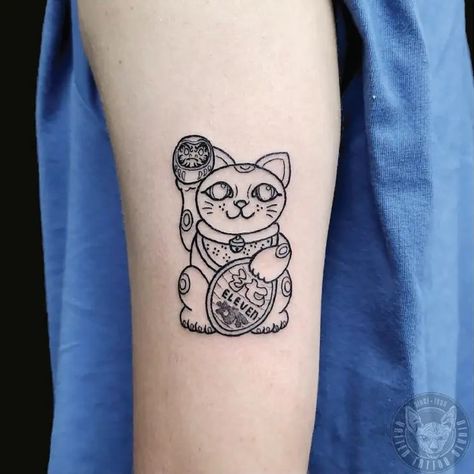 Small Lucky Cat Outline Fine Line Tattoo Idea & Design on Bicep Lucky Cat Outline Tattoo Done At Lucky Cat And Koi Fish Tattoo, Lucky Cat Outline, Line Work Cat Tattoo, Black Lucky Cat Tattoo, Nine Tailed Fox Naruto, Japanese Good Luck Cat Tattoo, Cat Outline Tattoo, Outline Tattoo, Cat Outline