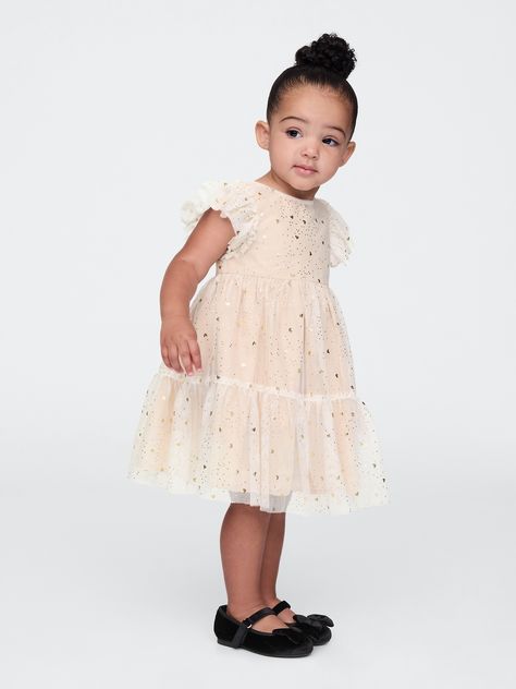 Soft mesh tulle, cotton-lined tiered dress.  Round neck with back keyhole button closure.  Short flutter sleeves.  Gold foil heart and dot print allover.  Cotton lining.  Diaper cover up to 3 years.  A fit and flare silhouette with an easy fit.  Hits at the knee.  Sizes range from baby to toddler. Tiered Tulle Dress, Girls Haircut, Toddler Party Dress, Girl Haircut, Foster Mom, New Years Dress, Gap Dress, Diaper Cover, Baby Gap