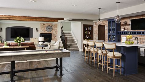 Industrial Style basement ideas, farmhouse style, Basement Design, Brick wall, Chicago brick, blue cabinets for bar, Navy Blue, wood floors, #provenza #rustic  #eclectic #shuffleboard #woodfloor #wetbar #distressed Farmhouse Basement, Industrial Basement, House Basement, Basement Room, Basement Layout, Recreation Room, Basement Reno, Dream Future, Small Basements