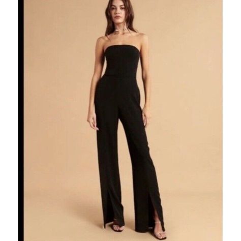 This Abercrombie & Fitch Black Jumpsuit Is A Must-Have For Any Stylish Woman's Wardrobe. The Nwt Size Large Tall Jumpsuit Features A Zip Closure And Is Perfect For Any Occasion. The Jumpsuit Is Made From High-Quality Materials And Is Designed To Last. The Black Color Is Versatile And Can Be Paired With Any Other Clothing Item. The Jumpsuit Is Perfect For Women Who Want To Look Their Best Without Sacrificing Comfort. Summer Wedding Guest, Spring Vacation, Strapless Jumpsuit, Vacation Beach, Women's Wardrobe, Split Hem, Black Jumpsuit, Stylish Women, Color Show