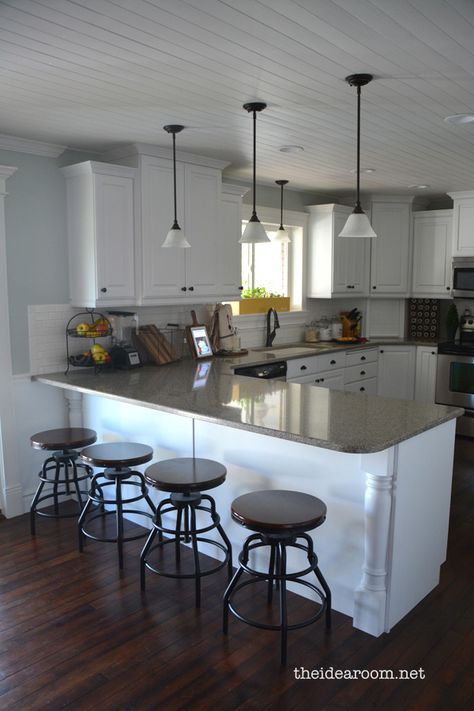 dark floors, white cupboards, neutral counter, wood ceiling... very pretty, and not over the top. Dark Kitchen Ceiling Ideas, Kitchen Peninsula Backsplash, Pendant Lights Over Peninsula, Peninsula Lighting, Planked Ceiling, Top Cabinets, Best Kitchen Lighting, White Cupboards, Kitchen Tour