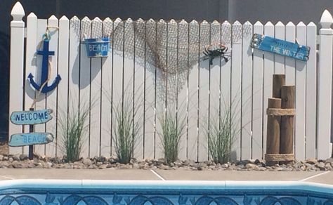 Beach Yard Decor, Beach Theme Outdoor Decor Patio, Beachy Backyard Pool, Beach House Privacy Fence, Beach Theme Landscape Ideas, Beach Theme Pool Area, Diy Beach Decor Outdoor, Pool Fence Decorating Ideas, Nautical Fence Ideas