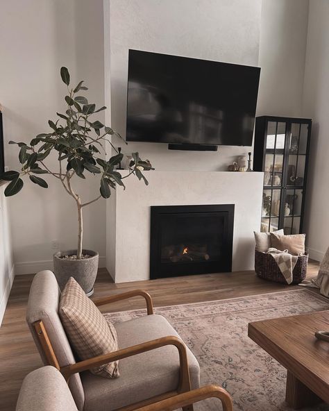 Stormy days call for curling up by the fireplace 🤍 #transitionaldesign #moderndesign #neutraldecor #venetianplaster #fireplacedecor Walls Beside Fireplace Decorating, Large Art Over Fireplace, Floor To Ceiling Fireplace With Tv, Fireplace Tv Decor, Living Room Decor With Fireplace, Living Room Fireplace Ideas, Fire Places, By The Fireplace, Venetian Plaster