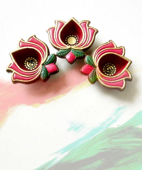 Lotus shaped Teracota diya Lotus Diya Painting, Lotus Diya Decoration, Diwali Clay Craft, Diya Panting, Diya Colour, Diya Colouring Ideas, Diy Diyas, Indian Handicrafts Decor, Clay Diya