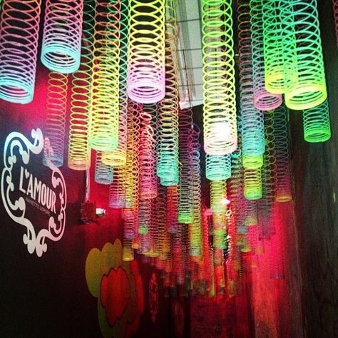 Ceiling of slinkys from @NYLON Magazine Glow Party Ideas, Neon Glow Party, Black Light Party, Blacklight Party, Glow In The Dark Party, Party Neon, 80's Party, Neon Birthday, Light Party