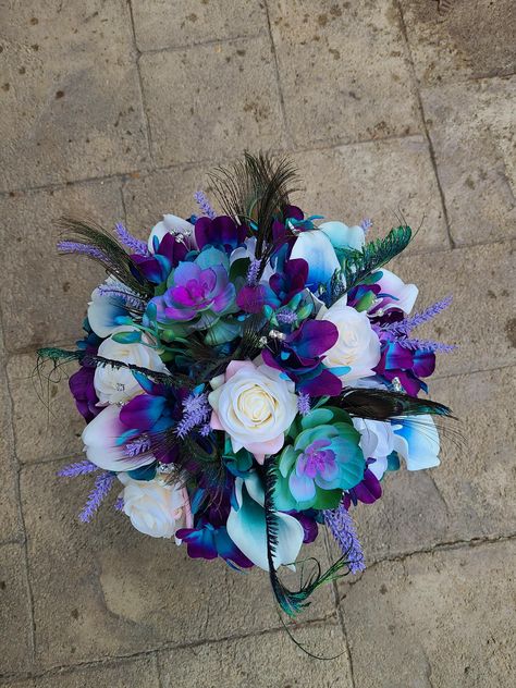 Teal And Dark Purple Wedding, Galaxy Orchid Bouquet, Wedding Color Schemes Blue And Purple, Peacock Flower Arrangement, Coraline Wedding, Teal And Purple Wedding, Flower Bouquet Lavender, Peacock Bouquet, Copper Wedding Theme