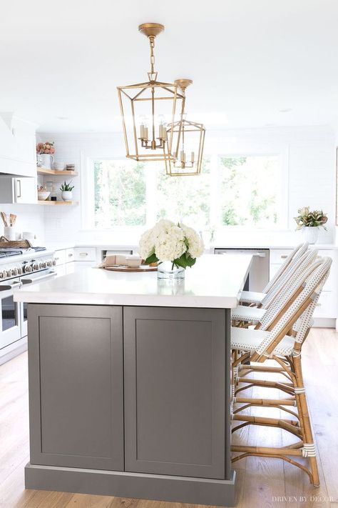 Love the color of this long, dark gray kitchen island with counter height seating! #kitchen #kitchens #kitchenrenovation #kitchenreno #kitchenremodel #kitchendesign #kitchenideas #countertop #kitchenisland #lighting White Kitchens With Quartz Countertops, Gray Island, Grey Kitchen Island, Dark Grey Kitchen, Driven By Decor, Gray And White Kitchen, White Kitchen Remodeling, New Kitchen Cabinets, Kitchen Remodeling Projects