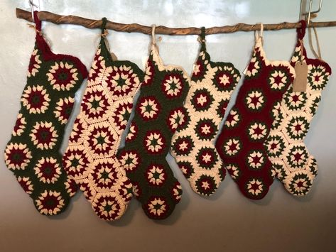 Vintage style retro granny square crocheted Christmas stockings to accent any Christmas decor.  These were hugely popular in the 1970's and evoke fond memories of Christmases past.  Stockings are 27 in. long and include a rustic style blank wooden name tag.  Width is 7 inches.  Stockings are made to order with custom colors as well as yarn color placement.  Choose from traditional Christmas green, red and white, antique olive green with cream and burgundy, sea foam green with white and burgundy, navy and light blue with white, aqua with gray and white and variegated blue with white for an icy cool look.   Please see photos for designs and colors available.  When ordering please start with center color you would like followed by second row color, then third and fourth row colors, and finall Hexagon Granny Square Stocking, Vintage Christmas Crochet, Crochet Stockings Christmas, Christmas Granny Square Crochet, Granny Square Christmas Stocking, Christmas Decor Styles, Crochet Christmas Decor, Granny Square Stocking, Granny Square Christmas