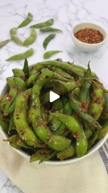 Asian Food | Recipes | Cooking on Instagram: "🌟Spicy Edamame🌟⁣ 🎥 & recipe by @magsspicedkitchen ©️ ⁣ ⁣ 👉Like & share with someone that would love this!⁣ ⁣ Enjoy a bowl of flavorful and healthy edamame, perfectly seasoned with a spicy kick! Whether it’s a quick snack or a party appetizer, these finger-licking goodies are sure to satisfy your cravings! 🤤🔥⁣ ⁣ INGREDIENTS:⁣ 1 lb frozen edamame pods⁣ 1 tbsp oil⁣ 1 tbsp finely minced garlic⁣ 1 tbsp oyster sauce⁣ 1 tsp honey⁣ 1 tsp chili garlic sauce⁣ 1 tbsp chili oil⁣ 1/2 tsp salt⁣ 1/4 tsp black pepper⁣ 1 tsp sesame oil⁣ 1/2 tsp red chili flakes (optional)⁣ ⁣ DIRECTIONS:⁣ - Bring a pot of water to a boil and add the frozen edamame pods. Cook for 6 minutes until they turn bright green. Drain and rinse under cold water.⁣ - In a skillet over Edamame Recipes Spicy, Spicy Edamame, Frozen Edamame, Edamame Recipes, Red Chili Flakes, Chili Garlic Sauce, Quick Snack, Party Appetizer, Chili Oil