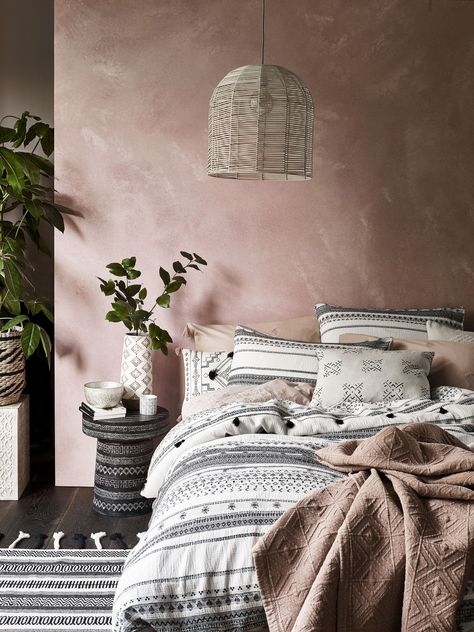 There is something sophisticated about a plastered-coloured, subtly distressed wall. While you could recreate this unfinished look with paint, we think the easiest way is with a pink wallpaper. #bedroom #bed #pinkbedroom #pink #distressedwallpaper #realhomes Wallpaper Bedroom Pink, Boho Bedroom Wallpaper, Pink Bohemian Bedroom, Wallpapers For Bedroom, Wallpaper Bedroom Ideas, Pink Room Design, Bedroom Wallpapers, Bohemian Bedrooms, Beautiful Bed Designs