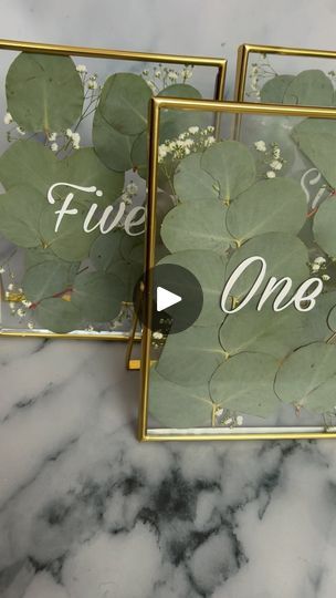 We LOVE florals🍃☀️

Gold Table Number Frames with Eucalyptus & Baby Breath
Name Tags with Baby Breath & a Beautiful Gold Wax Seal
Eucalyptus Themed Menus... | By S&F EventsFacebook Wedding Name Tags Ideas, Graze Boards, Table Number Frames, Gold Table Number, Gold Wax Seal, Wedding Name Tags, Gold Table Numbers, Baby Breath, Baby S Breath