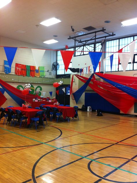 Pendant flags from basketball hoop to basketball hoop add some much needed color and transform the space to make it more festive. Spring Dance Themes, Pbis Rewards, Spring Social, Spring Dance, Dance Themes, Volleyball Mom, School Dance, Plastic Tablecloth, Neon Party