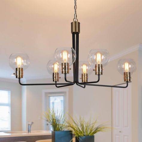 Modern minimalism and retro influence meet in this 4-light chandelier. The striking chandelier features elegant arms with upward hanging 6 clear globe glass shades, bringing a bright and warm light. Dining Table Light Fixture, Black Ceiling Light, Pendant Lighting Modern, Glass Globe Pendant Light, Dining Table Light, Black Ceiling Lighting, Modern Lighting Chandeliers, Gold Pendant Lighting, Black Light Fixture