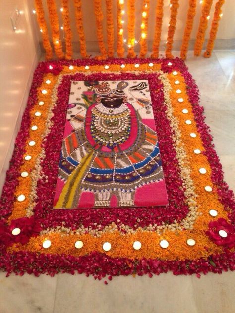 With fresh flowers Goverdhan Pooja Rangoli, Shrinathji Rangoli Designs, Pichwai Rangoli Designs, Goverdhan Maharaj, Rangoli For Competition Unique, Shreenathji Rangoli Design, Balaji Rangoli, Shreenathji Rangoli, Rangoli God