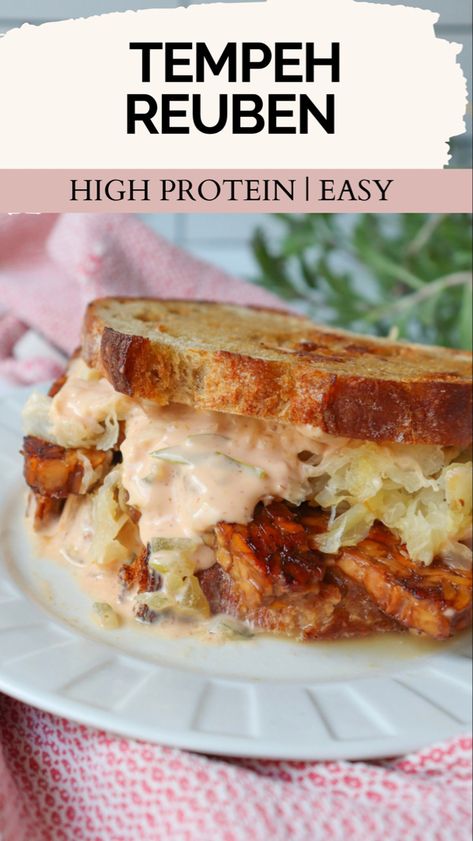 Tempeh Reuben sandwich with sauerkraut and vegan Russian dressing on a white plate. Tempeh Ruben, Vegetarian Reuben Sandwich, Tempeh Blt, Tempeh Reuben, Tempeh Dinner, Tempeh Meals, Vegan Cuban Sandwich, Vegan Rueben Sandwich, Dairy Free Sandwiches