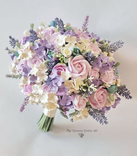 I Make Clay Bouquets That Brides Can Keep Forever | Bored Panda Enchanted Garden Bouquet, Lilac Bouquet Quinceanera, Wedding Bouquets Bride Purple, Beautiful Wedding Bouquets Brides, Xv Bouquet Flower, Flower Bouquet Bride, Flowers For Wedding Bouquet, Pastel Wedding Bouquet, Wedding Bouquet Purple