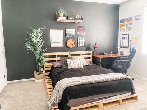 We painted this wall black and made a pallet bed for my teenage son Bed Teen, Teenage Son, Black Bed, Pallet Bed, Bed Black, Teen Boy Bedroom, Boy Bedroom, Black Bedding, Teen Room