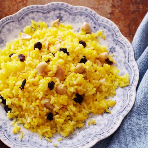 This rice is Indian inspired and so we call for traditional basmati, but Texmati rice will give much the same effect, and in fact any white rice is go... Rice With Cashews, Rice With Raisins, Raisins Recipe, Indian Chicken Dishes, Grains Recipes, Saffron Recipes, Raisin Recipes, Indian Dinner, Saffron Rice