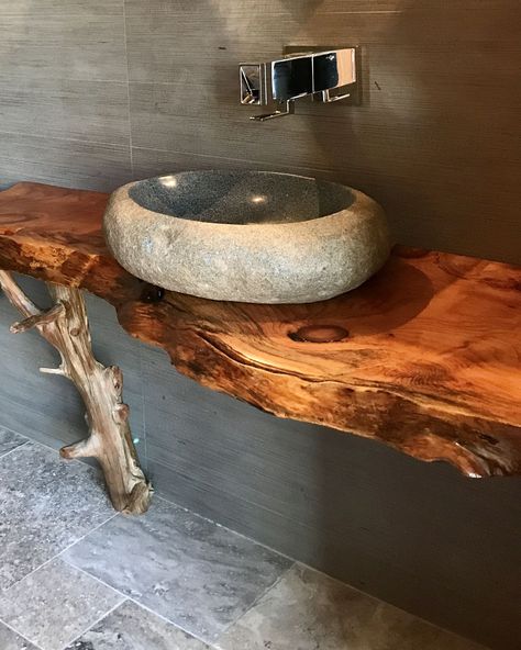 Organic approach to our pool house bathroom. Loving the stone sink, live edge counter and cedar branch leg perfectly balanced with modern tap and stone walls. Upgrade your bathroom with our stunning sinks – choose from the raw, natural beauty of stone or the refined elegance of handmade porcelain. Our natural stone sinks exhibit unique textures and hues, each piece a testament to the Earth' Bathroom Stone Sink, Live Edge Bathroom Counter, Bathroom Sink Ideas Modern, Stone Vanity Bathroom, Wood Sink Bathroom, Stone Sinks Bathroom, Stone Sink Bathroom, Live Edge Vanity, Cedar Branch