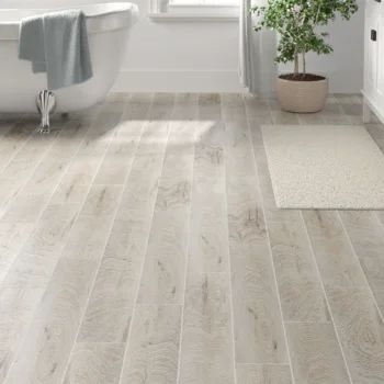 Itona Tile Hereford 6" x 36" Porcelain Wood Look Wall & Floor Tile | Wayfair Modern Craftsman Flooring, Tile That Looks Like Hardwood Floor, Bathroom Floor Tile Wood Look, Sand Floor Tiles, Farmhouse Flooring Tile, Tile And Wood Floors Combo Kitchen, White Bathroom Wood Floor, Coastal Tile Flooring, Light Bathroom Floor